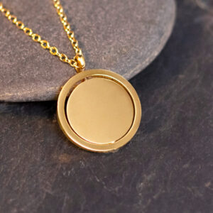 Dije Giratorio Dorado